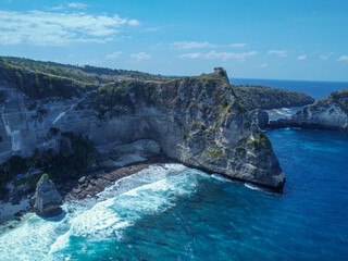 Aerial photo of Nusa Penida bay, white waves and crystal clear water