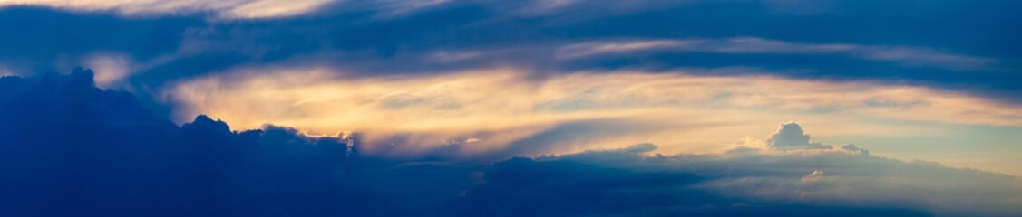 Sky panorama. Beautiful dramatic big clouds in the sky. Landscape of the power of heaven and nature. Copy space
