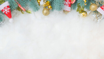 Frame made of Christmas decorations on snowy background with copy space. Festive New Year and Christmas backdrop