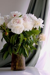  bouquet of white flowers peony in the vase on table