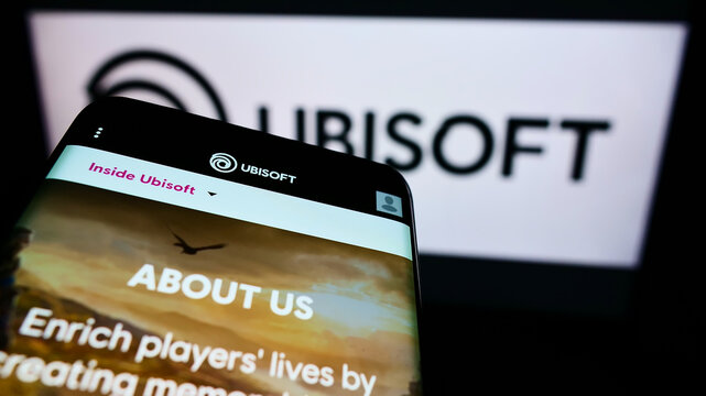 Stuttgart, Germany - 01-06-2022: Mobile phone with webpage of French video game company Ubisoft Entertainment SA on screen in front of logo. Focus on top-left of phone display.