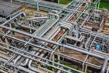 Steel long pipes flowing symbol and pipe elbow in station oil factory during refinery Petrochemistry industry in gas site