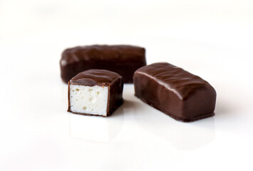 Chocolate marshmallow candy isolated on white background
