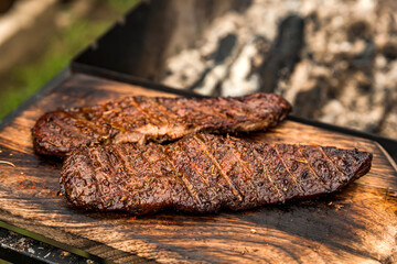 Cooked piece of denver steak meat after grill, barbeque