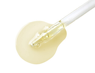 Drop of hydrophilic oil from pipette on white background