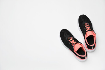 Pair of stylish sport shoes on white background, flat lay. Space for text