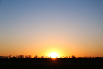 Beautiful view on field during sunset. Picturesque landscape