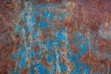 Blue painted metal wall with rusty parts texture