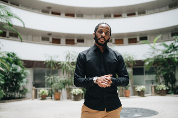 Portrait of black man in a hall in a condo