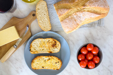 Olive-fried bread with cheese and tomato