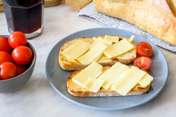 Olive-fried bread with cheese and tomato