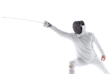 Dynamic portrait of young man, fencer in in fencing costume with sword in hand training isolated on...
