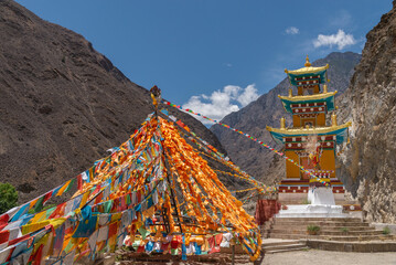 Strings of prayer flags and a monastery