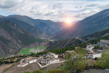 Fototapeta na wymiar A peaceful village surrounded by mountain range valley