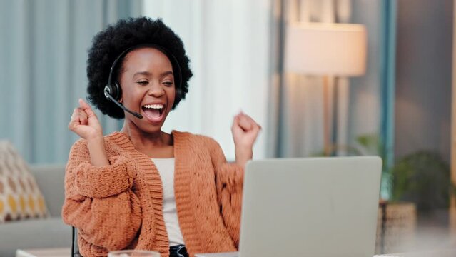 Excited, happy and dancing call center agent celebrating deal, promotion and sale after video call on laptop. Smiling, successful and cheerful freelance telemarketer cheering while working from home