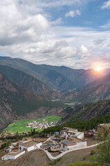 A peaceful village surrounded by mountain range valley