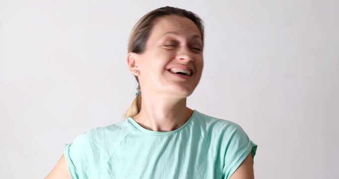 Surprised joyful woman laughs, close-up