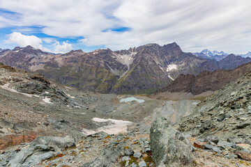 Excursion to the Gran Paradiso in the Alps. Search for rocks, minerals and precious stones. Study of the surface of rocks with sedimented debris over time. Lunar landscape, Martian landscape.