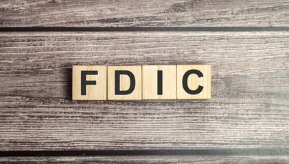 fdic word on wooden blocks and wooden background