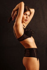 Sexy woman posing in black underwear