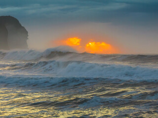 Sunrise at the seaside with large and powerful sets