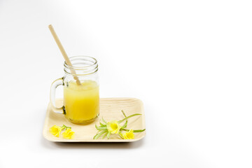 Bamboo straw in an orange juice glass