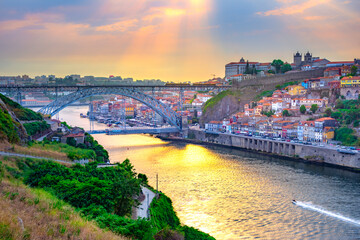 Fototapeta na wymiar Famous bridge Ponte dom Luis above old town of Porto at river Duoro, Portugal