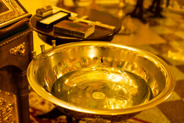 baby christening. Ceremony of a christening in Christian church. baptismal font flower