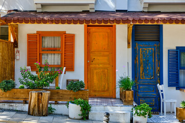 Fototapeta na wymiar Colorful streets with white houses and curly flowers in Bodrum
