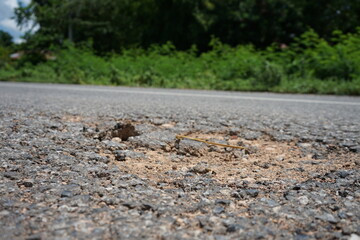Damaged roads are dangerous for road users.