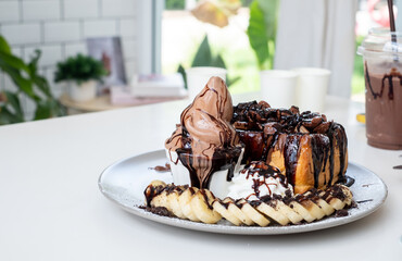 chocolate toast ,ice cream and toast on white table in coffee shop