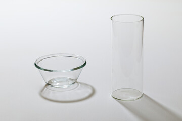Straight glass and glass bowl on the white background.