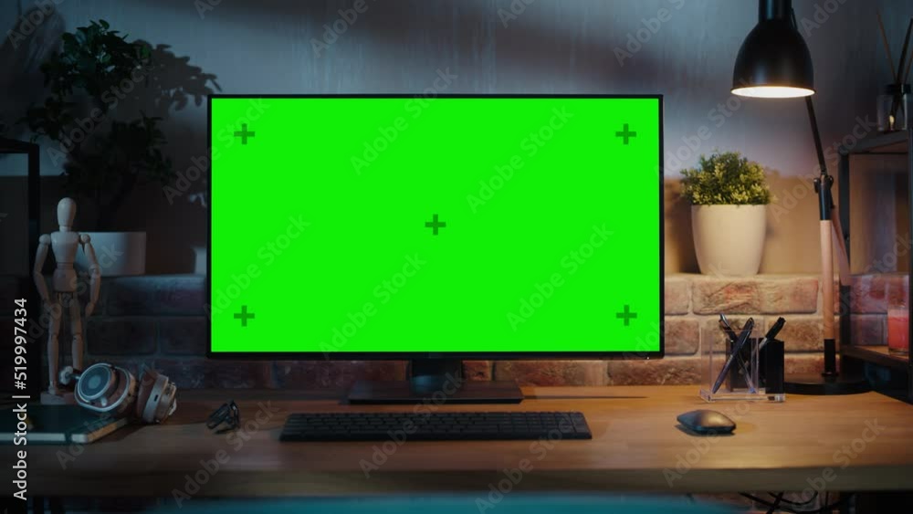 Poster Zoom Out Shot of a Modern Personal Computer Monitor with Chroma key Green Screen Display Standing on the Desk of a Cozy Home Office. Living Room Created by Interior Designer with Good Taste and Style.