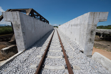 Railway track on concrete bridge.