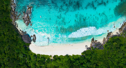 Above view of the island and sand beach with tourist people and  Beautiful sea waves in Summer tropical background