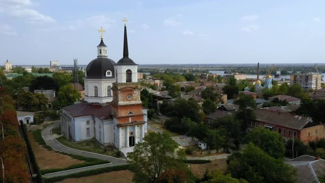 Aerial drone footage of Cherson city, church and houses with green trees Ukraine High quality FullHD footage