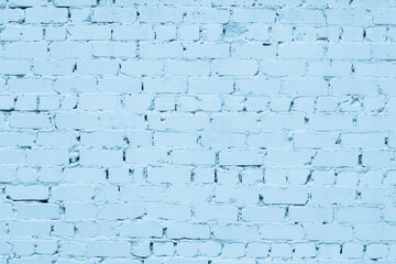 Old rough pastel blue brick exterior wall texture. Light color painted brickwork. Grunge vintage abstract background