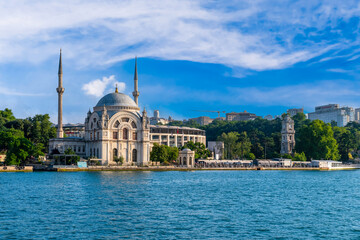 Istanbul, Turkey - June 18 2022:View of Mosque Bezm-i Alem Valide Sultan (Dolmabahce) and clock tower