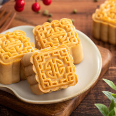 Delicious mung bean moon cake for Mid-Autumn Festival food mooncake on dark wood table background.