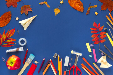 Back to school or education concept. Top view of various items in disorder: school supplies, autumn...