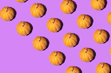 Melons, fresh exotic fruit, creative pattern on bright pink purple background. Summer refreshment idea. 