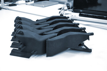 Black model printed on 3D printer in laboratory office. Object printed on 3D printer from plastic...