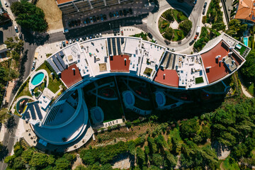 Fototapeta na wymiar Lisbon, Portugal - July 29, 2022: Aerial drone view of luxury condominium next to Parque dos Poetas in Oerias, translated to Poet's Park