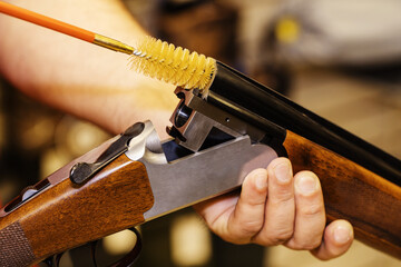 A ramrod for cleaning weapons. Shotgun barrel cleaning process. Care of firearms with the help of...