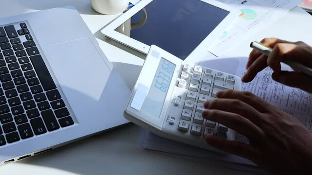 Accountants calculate accounts and make statistics of operating profit data