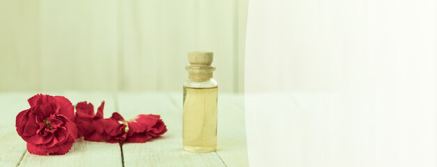 A bottle of aromatic oil made from fresh flower petals