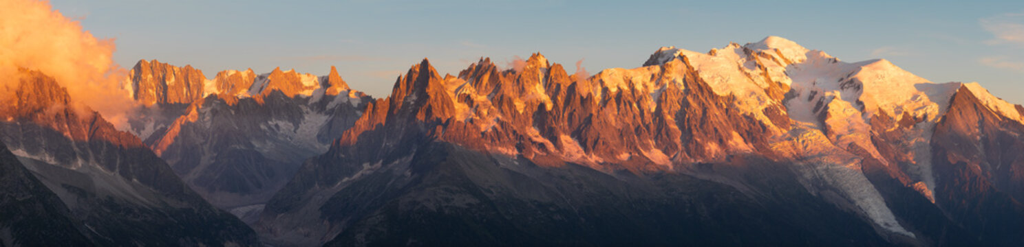 The panorama of Mont Blanc massif Les Aiguilles towers and Grand Jorasses in the sunset light. © Renáta Sedmáková