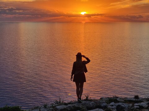 silhouette of a woman on a sunset