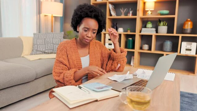 Stressed, unhappy and worried woman calculating finance, budget and savings on laptop with paperwork and book. Anxious, nervous and upset afro lady planning, making a mistake and overspending money