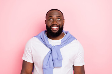 Photo of good mood cheery man look up see black friday shopping promo sales ad isolated on pink...
